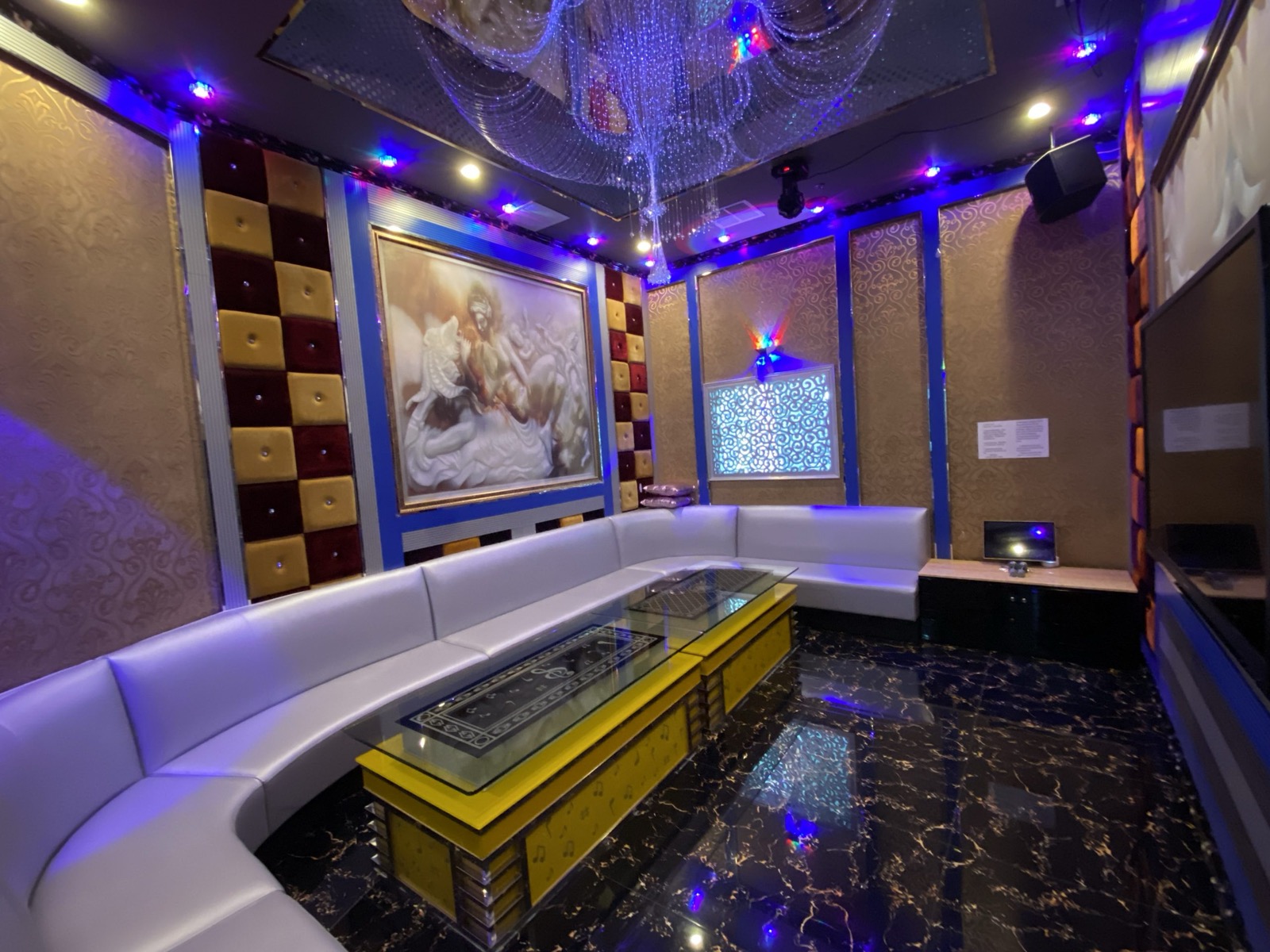 Luxury karaoke room with sofa seating and entertainment screen at Golden Lounge KTV Fremont